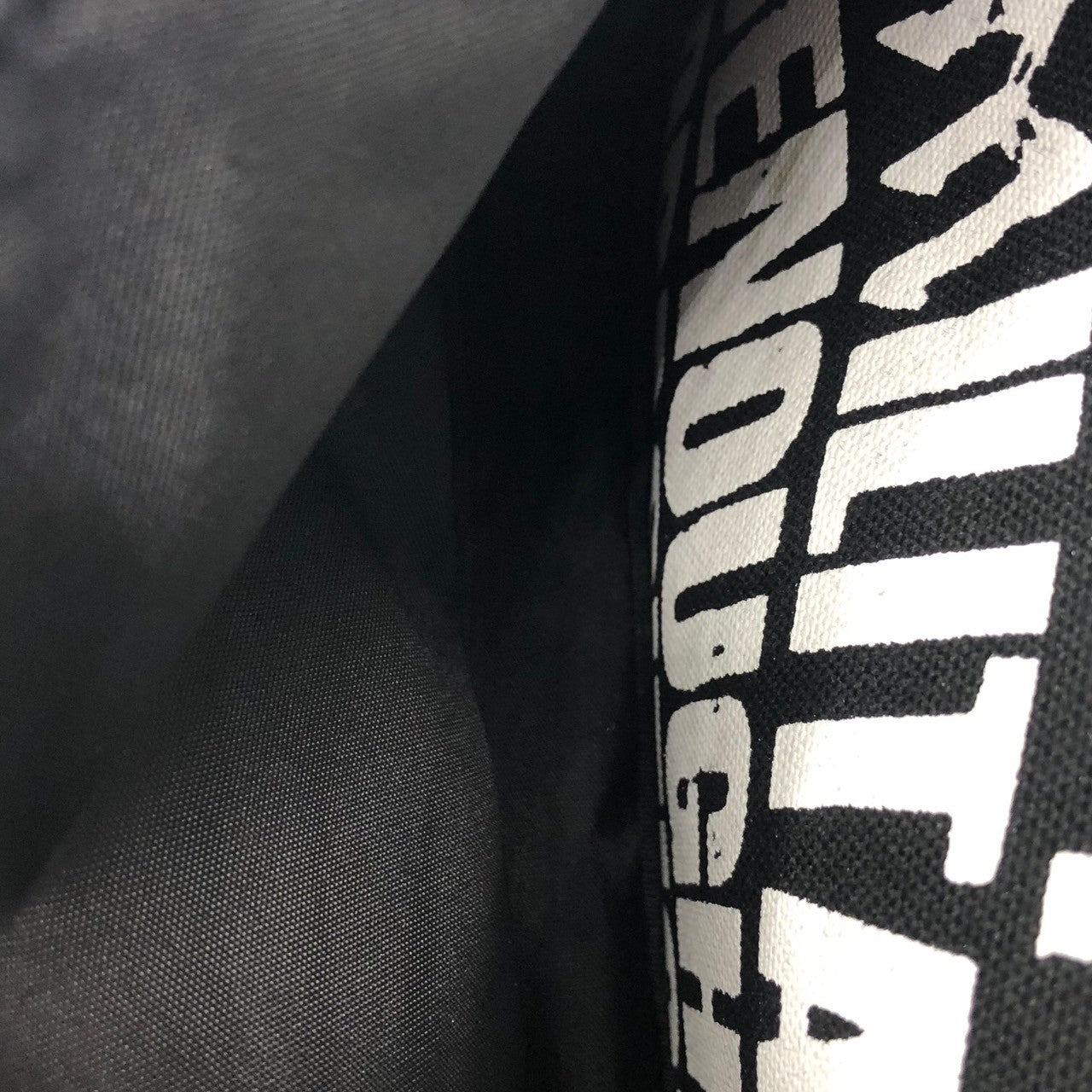 GOODENOUGH × militant pacifist × FABRICK(グッドイナフ×ミリタントパシフィスト×ファブリック) all over logo backpack ロゴ リュック バックパック ブラック×ホワイト