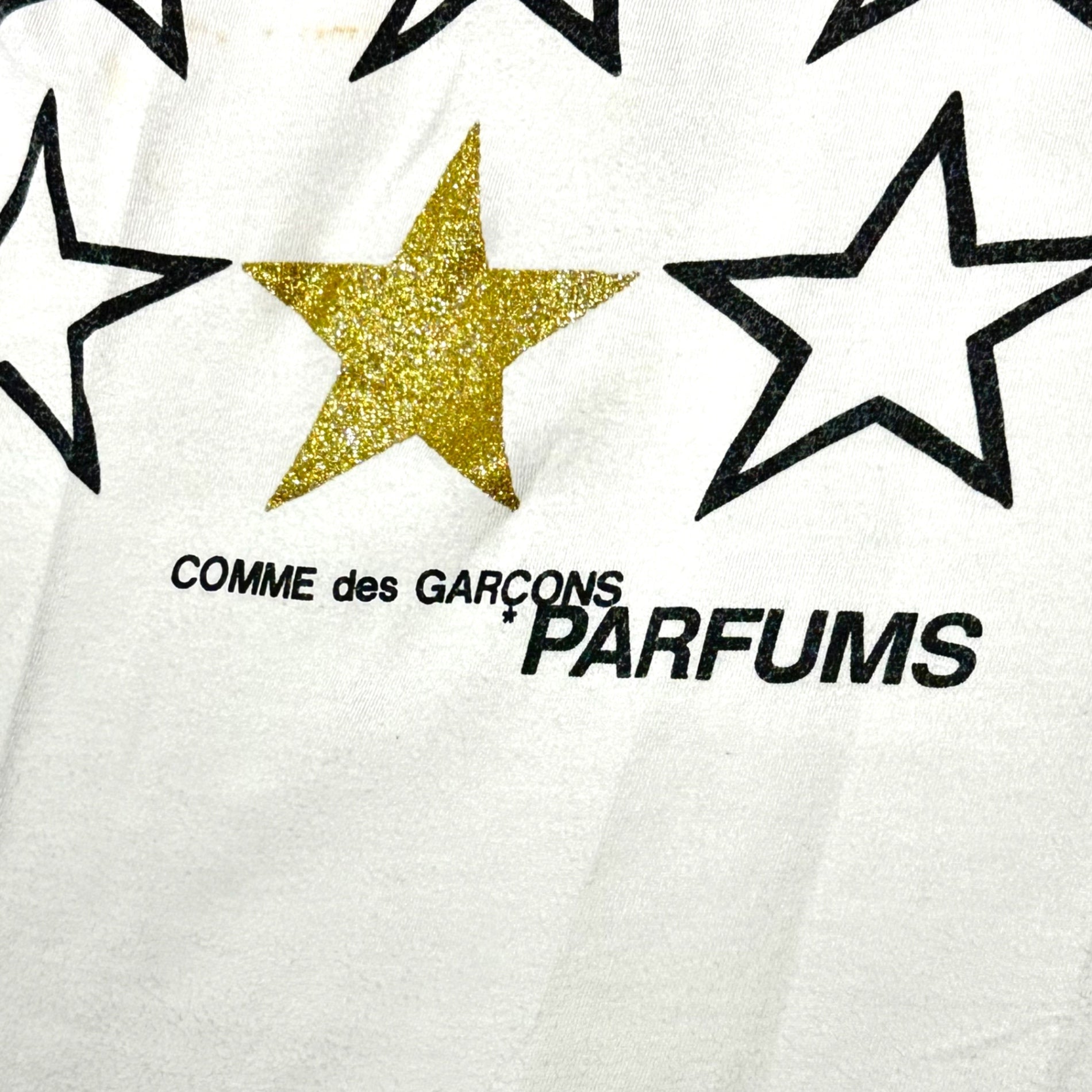 COMME des GARCONS PARFUMS(コムデギャルソンパルファム) Star Print T-Shirt スタープリント Tシャツ ホワイト ブランドロゴ取れ
