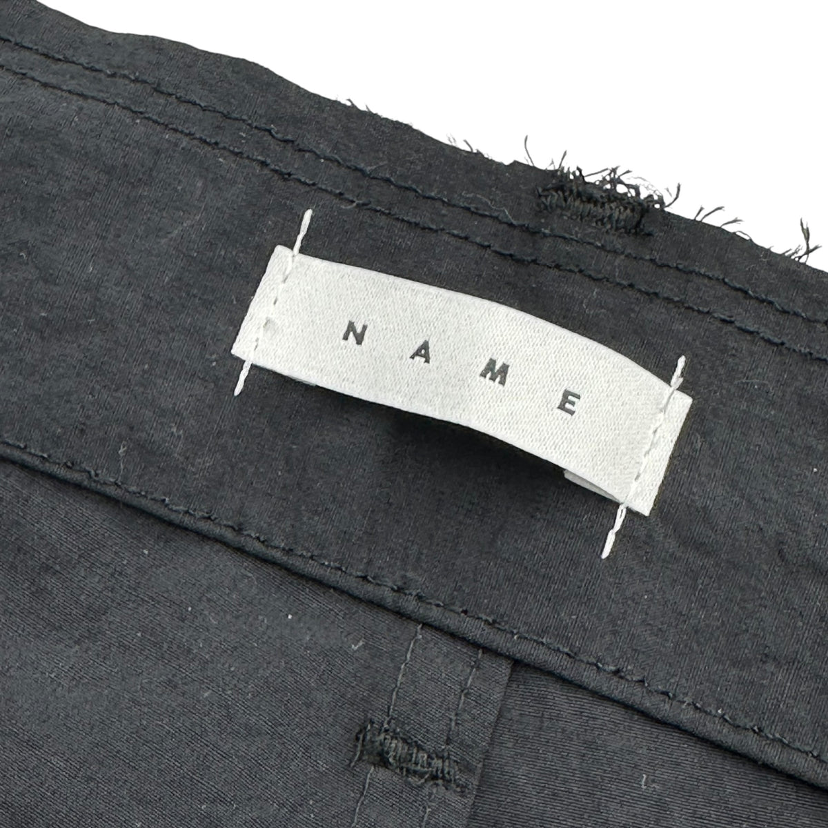 Name.(ネーム) 2026SS NYLON TWILL ONE TUCK CARGO SHORTS : TELE CUT ナイロン ツイル 1タック カーゴ ショーツ NMPT-044 1 ブラック ハーフ ショート パンツ