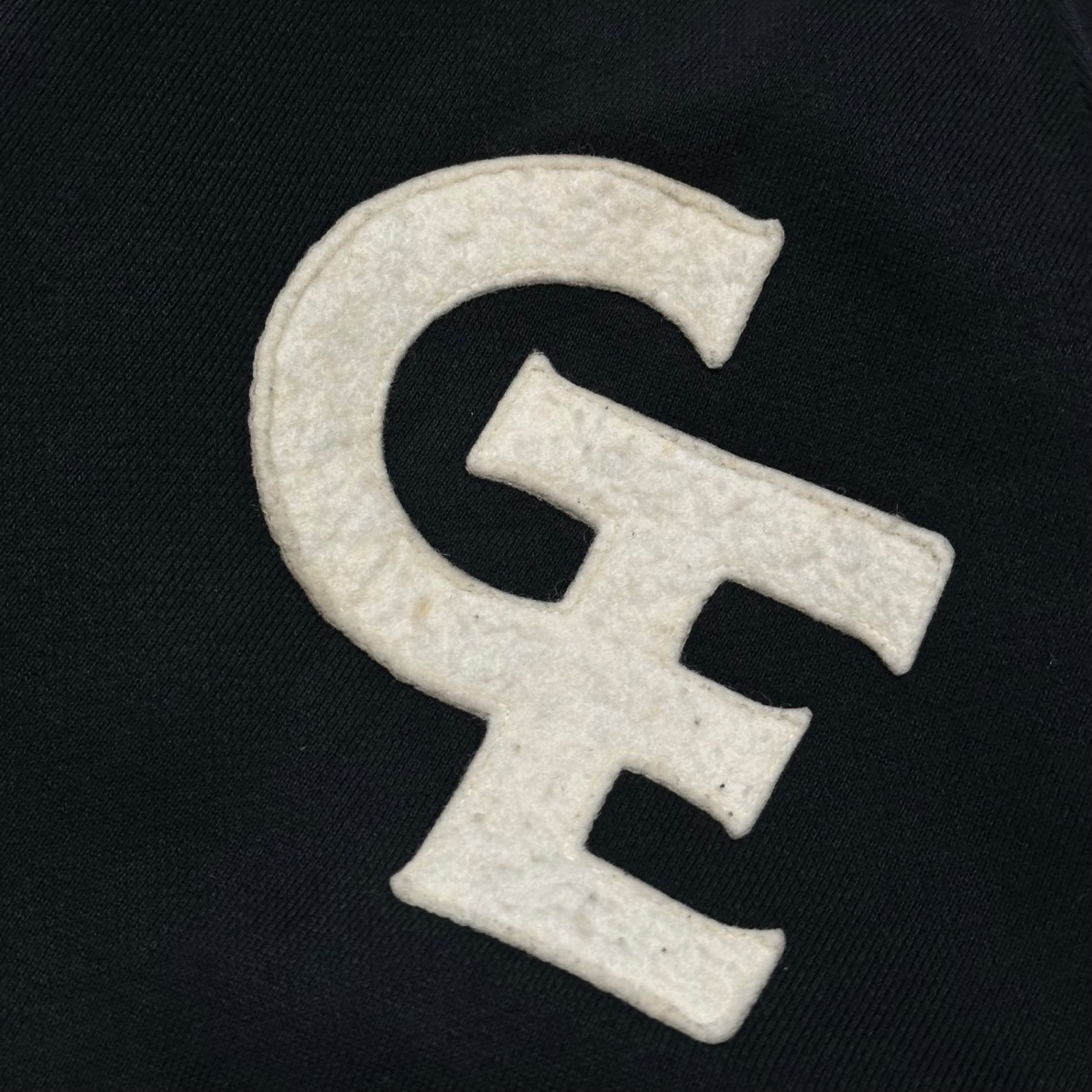 GOODENOUGH(グッドイナフ) 90's GE Felt Logo Snap Button Sweatshirt