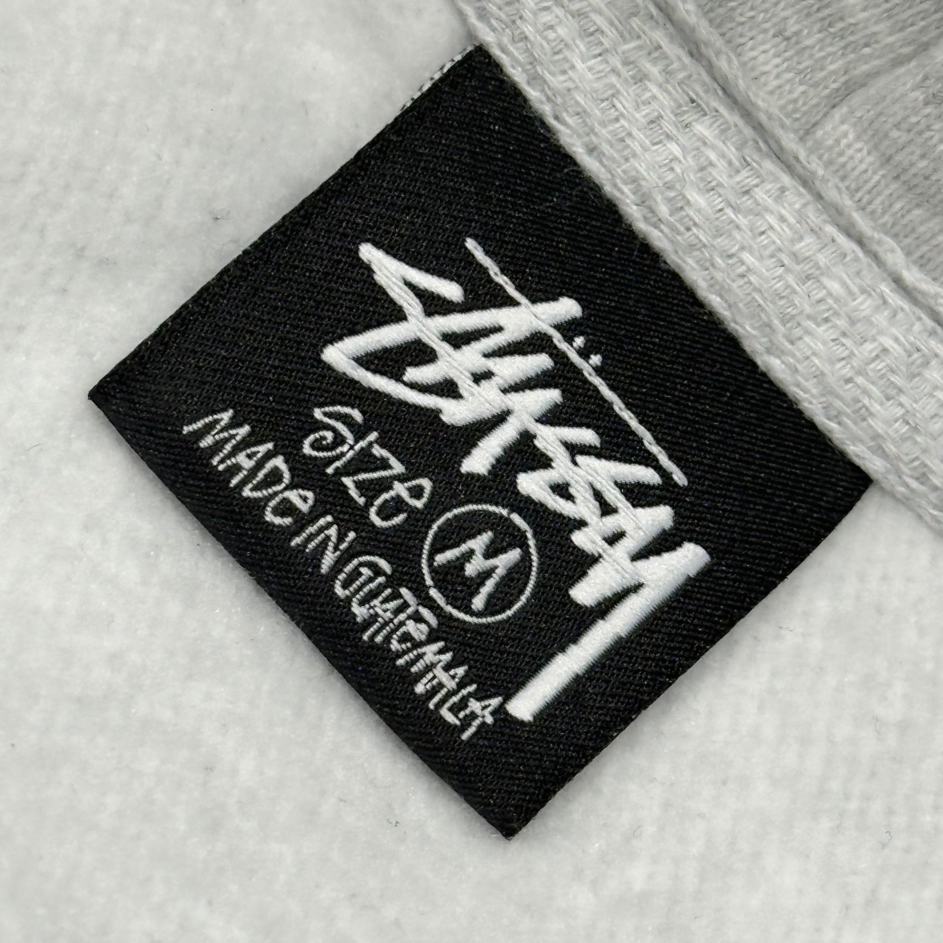 STUSSY(ステューシー) World Tour Hoodie ワールドツアー フーディ M ライトグレー