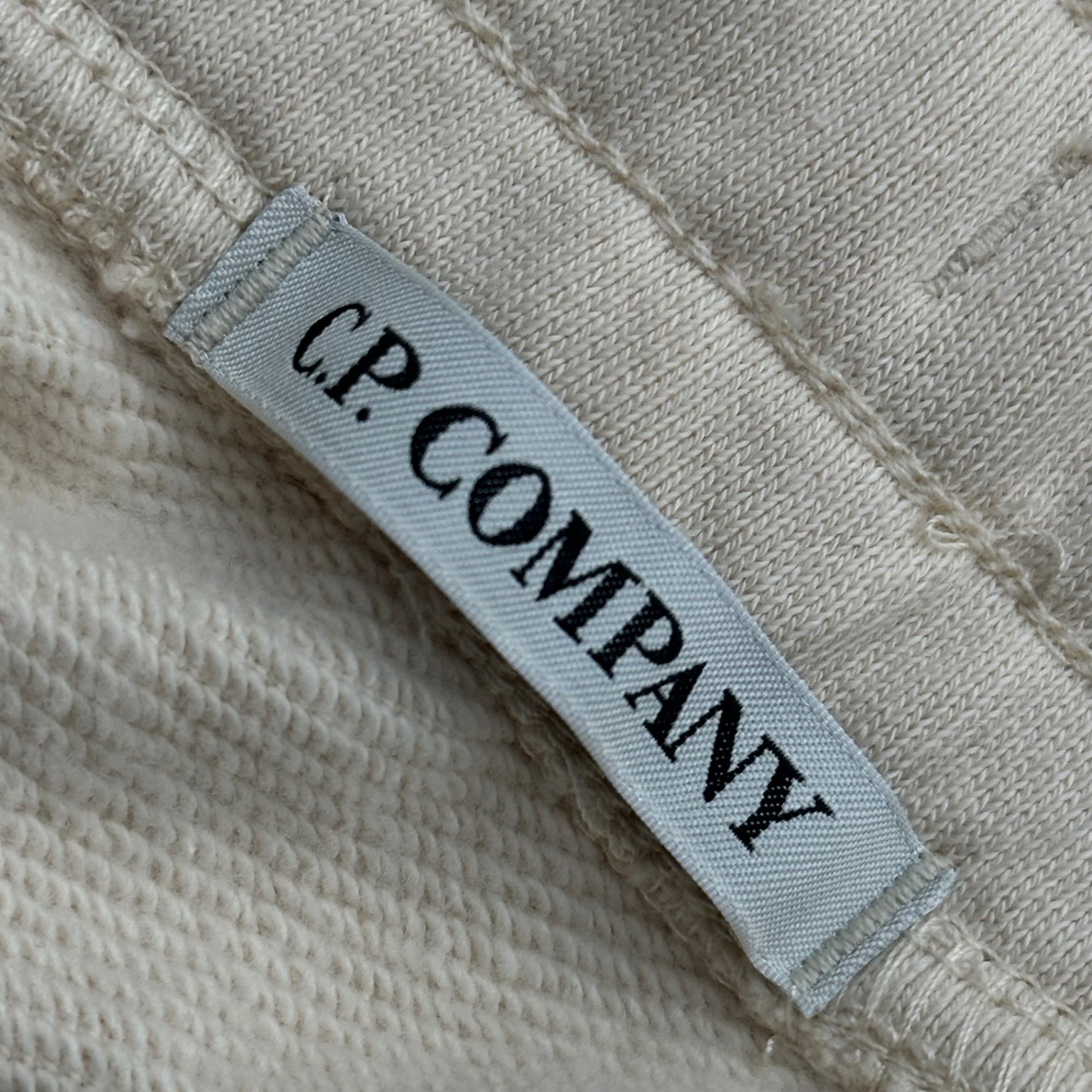 C.P.COMPANY(シーピーカンパニー) 2024SS Diagonal Raised Fleece Sweatpants サイドジップ スウェット パンツ 16CMSP084A 005086W S アイボリー