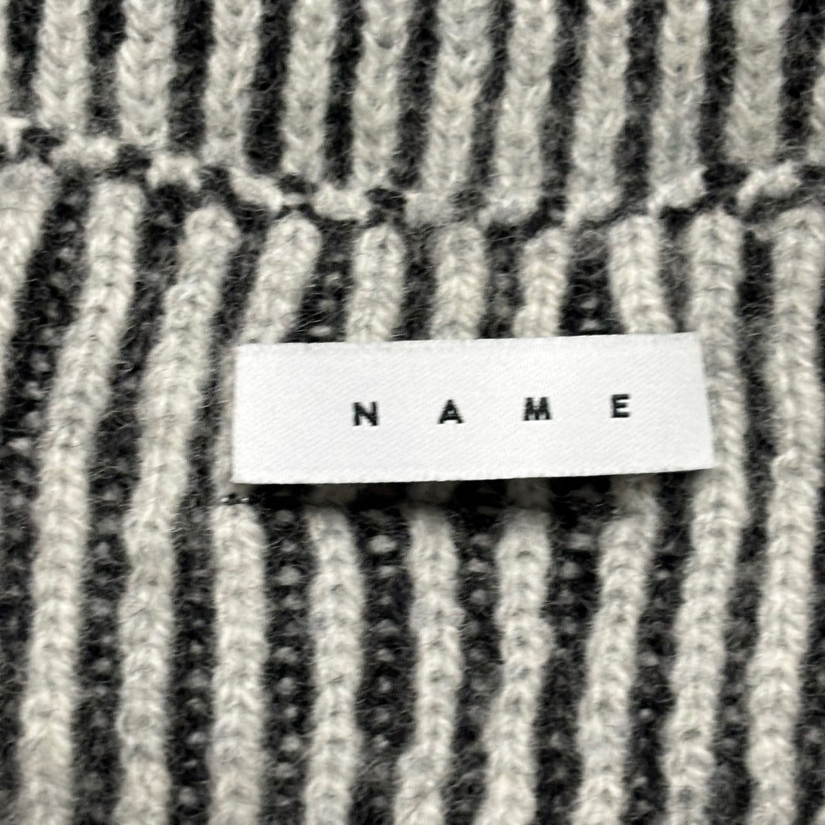 Name.(ネーム) 2025AW REVERSIBLE WOOL DRIVERS KNIT リバーシブル ウール ドライバーズ ニット NMKN-009 2 ブラック×グレー