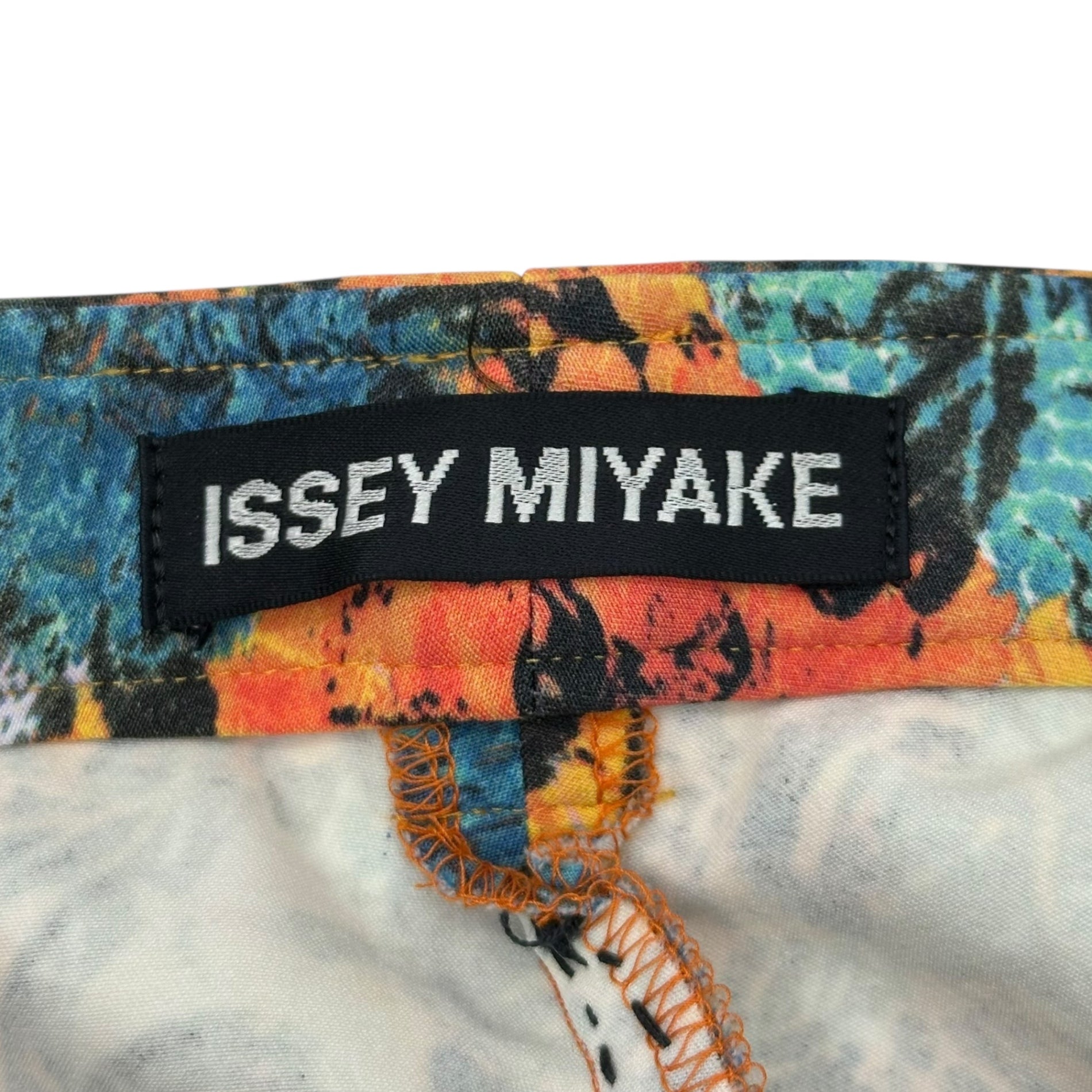 ISSEY MIYAKE(イッセイミヤケ) All-over print stretch pants オレンジ×ブルー